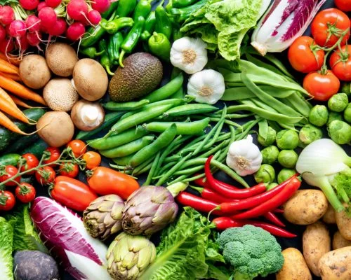 Panoramic food background with assortment of fresh organic vegetables